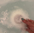 scentia essential oil chakra bath bombs fizzing in  a bath